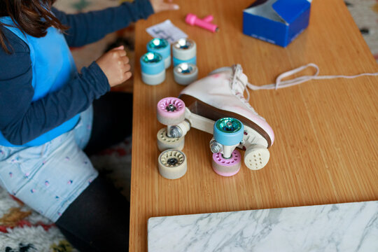 Child swapping skate wheels