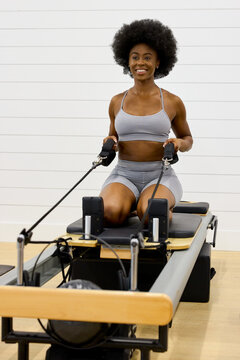 Pilates Reformer Workout at a Gym Studio