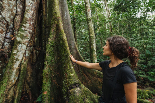 Woman touching a tree in nature
