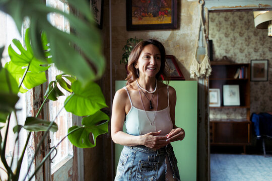 A woman spends time in her furniture restoration studio