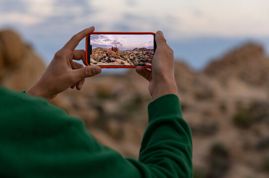 Tourist take photo cell phone Joshua Tree Landscape 