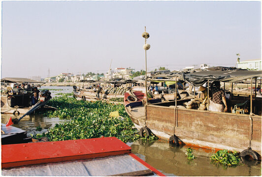Market boats float on a waterway. Floating market. Mekong Delta.