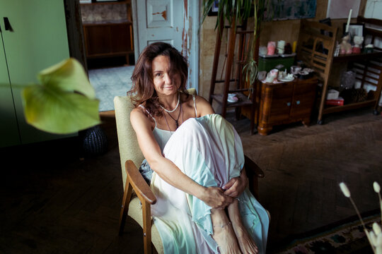 A woman spends time in her furniture restoration studio