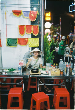 Enjoying Pho Bo at a street food stall in Vietnam