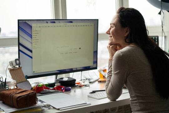 Woman Concentrating on Desk Work