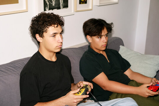 Two teens playing video games