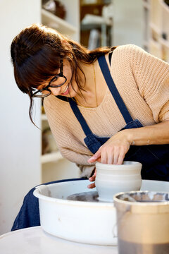 Woman Making Pottery