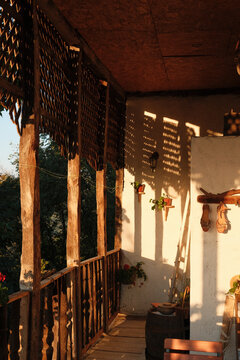 Sunlight on a rustic balcony with traditional ethnic details