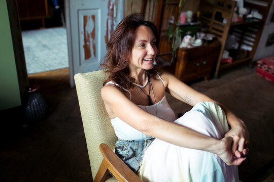 A woman spends time in her furniture restoration studio