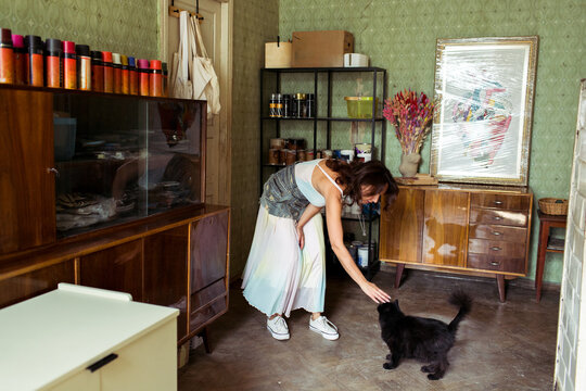 A woman spends time in her furniture restoration studio