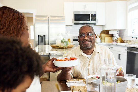 Serving food  during the family meal