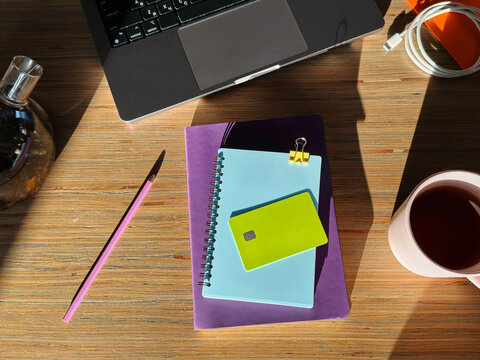 Workspace with notebook, pen, and laptop
