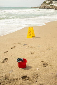 Wet Floor Sign On Beach