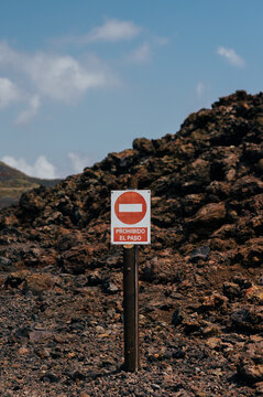 Prohibido el paso sign on volcanic lava field, La Palma