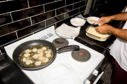 ugc Frying breaded shrimp on stovetop with direct flash