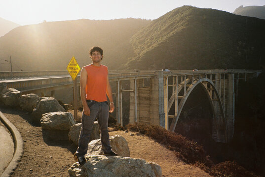 Man Stands by Bixby Bridge on Big Sur Coastal Highway