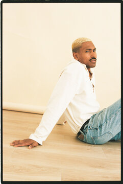 Man sitting on wooden floor