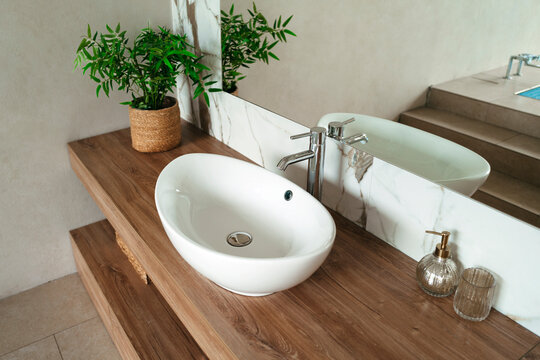 Modern Bathroom With Sleek Sink and Natural Touches