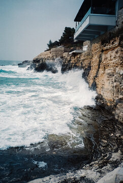 Waves crashing against rocky coastal cliffs
