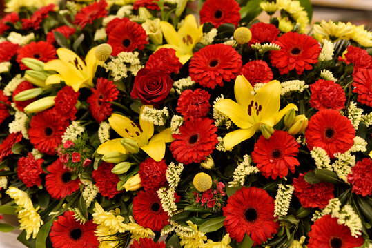 Decorative uniform texture of yellow and red flowers arranged
