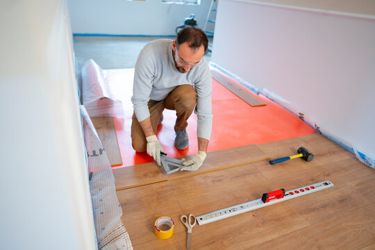 A man is working on a home renovation