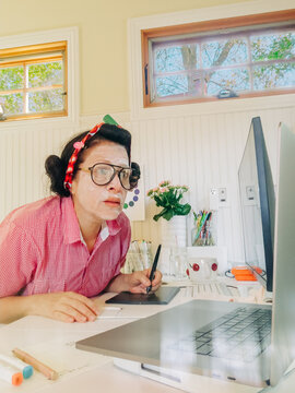 Multitasking  Woman at Home Desk