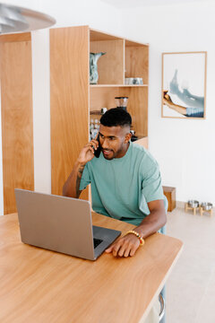 Professional works remotely in a hybrid setup at home