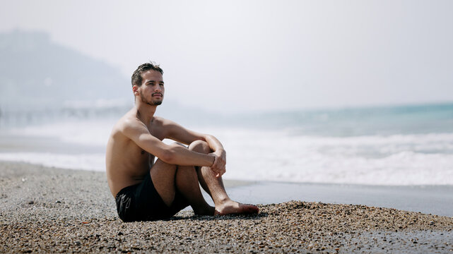 Contemplative Moment by the Shore