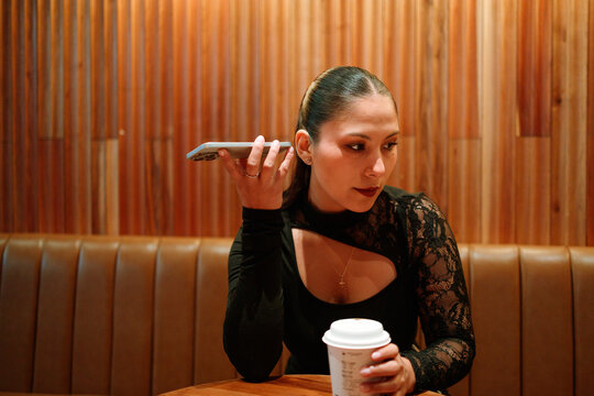 Woman listening to voice message