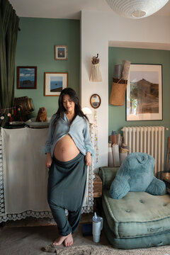 Pregnant Woman Relaxing at Home in Cozy Interior