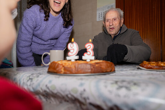 Man Lighting Birthday Candle