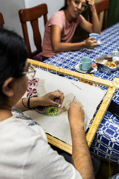 Skilled textile artisan working on small business