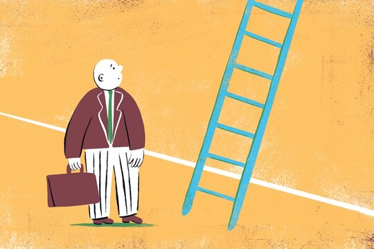 Businessman standing in front of a ladder