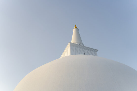 Buddhist temple stupa against blue sky, Sri Lanka