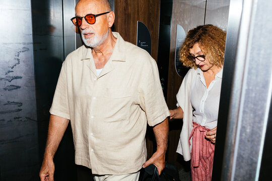 Senior Couple Checking in the Hotel on Vacation
