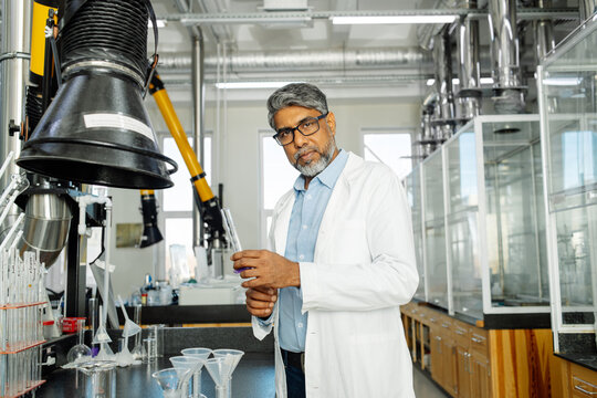 Indian scientist in white coat working in laboratory