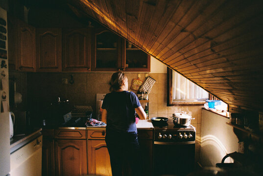 Woman prepares lunch in the kitchen