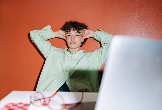 Woman stretching arms and back after work