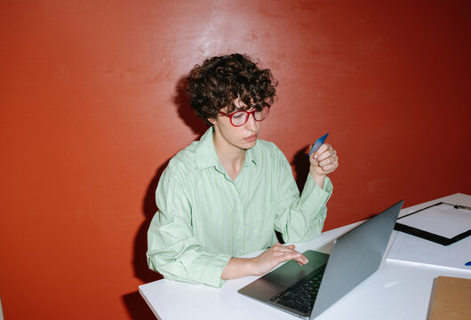 Woman with credit card making payments
