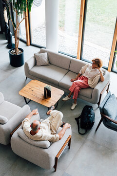 Business Senior Couple Relaxing in Hotel Lounge