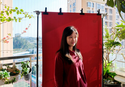 A young Chinese girl on a balcony during Chinese New Year