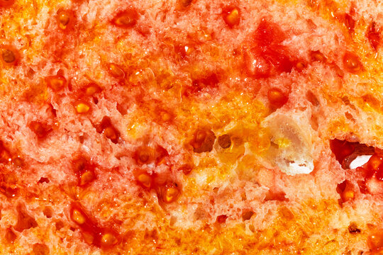 close-up of tomato-rubbed bread with olive oil, pa amb tomaquet