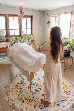 Wellness Session in a Sunlit Room With Plants and Relaxation