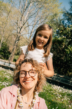 Mother and Daughter Enjoy Time Outdoors in a Sunny Park