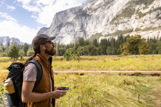 Cell Phone earbud music hike Photo Yosemite Park valley view
