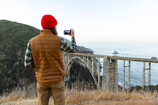 Photographer mobile phone camera  Big Sur Bixby Bridge  California 