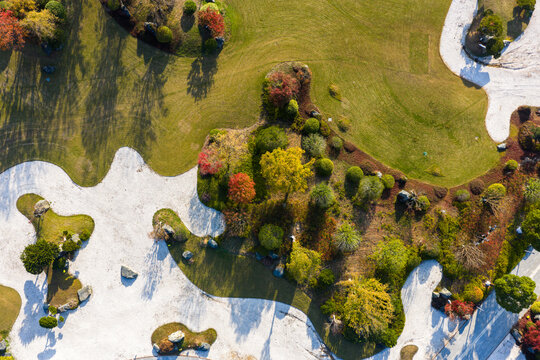 geometric park with colorful autumn trees.