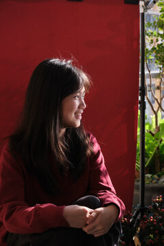 A young Chinese girl on a balcony during Chinese New Year