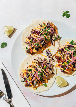 Vegan tacos with meat replacement on white plate