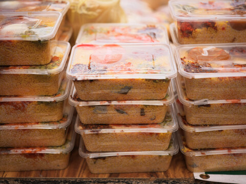 Meal Containers of Biriryani Stacked at a Food Market